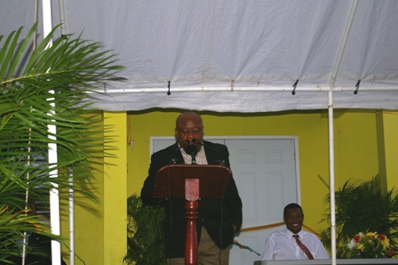 Minister for Social Development on Nevis Hon. Hensley Daniel at the official opening ceremony of the Fountain Community Centre with Minister of Trade and Fountain Villager Hon. Dwight Cozier looking on in the background.